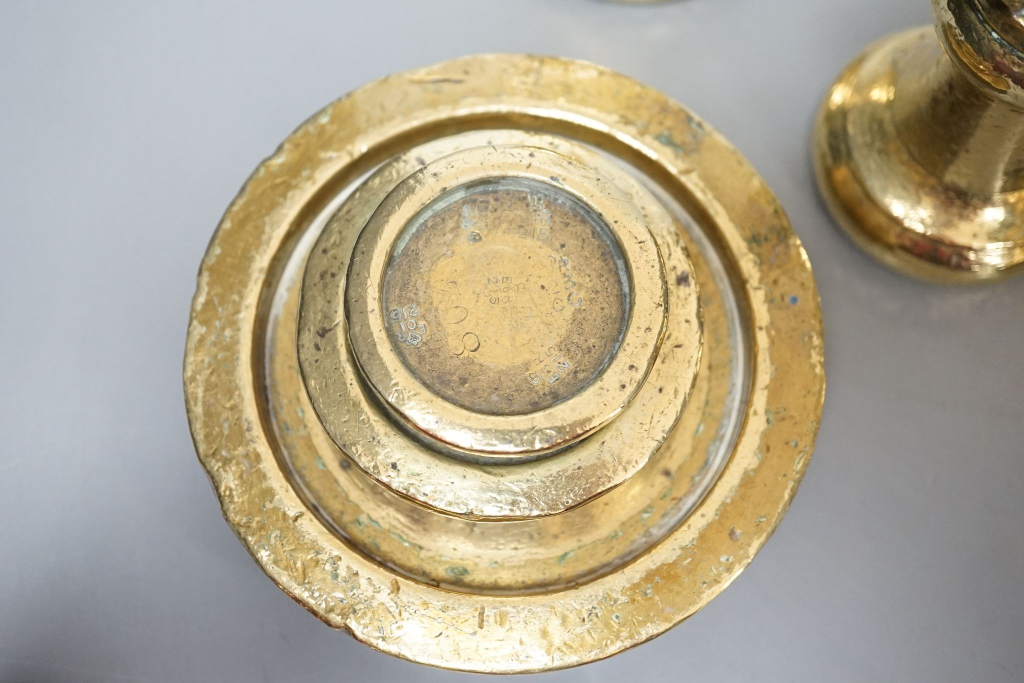 A set of 5 Victorian graduated cast brass bell weights and 3 graduated cast brass disc weights (8) 18cm